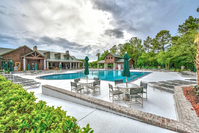 5718 Herring Gull Cir N, Myrtle Beach, SC 29582 - community pool featuring a patio area