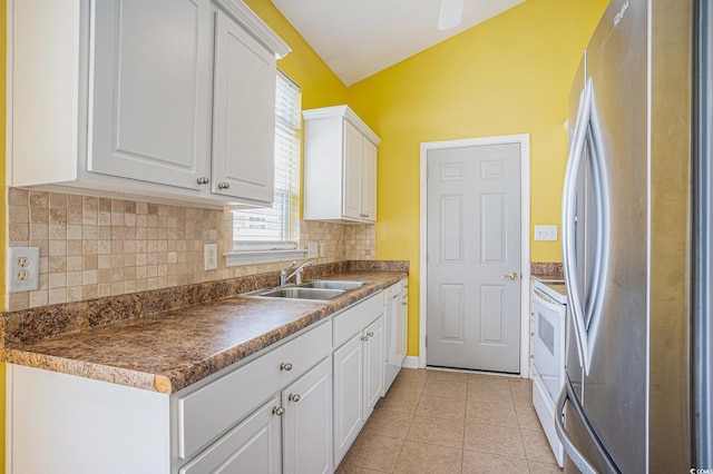 264 La Patos Dr, Myrtle Beach, SC 29588 - kitchen featuring freestanding refrigerator, a sink, white electric stove, lofted ceiling, and tasteful backsplash
