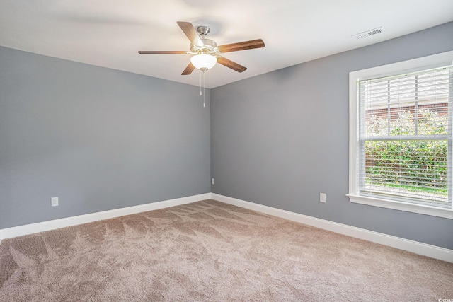 2004 Potomac Ct, Myrtle Beach, SC 29579 - unfurnished room featuring carpet, healthy amount of natural light, ceiling fan, and baseboards