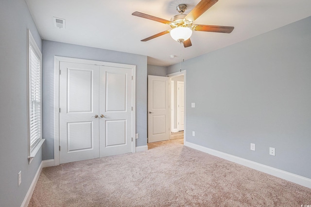 2004 Potomac Ct, Myrtle Beach, SC 29579 - unfurnished bedroom featuring light colored carpet, baseboards, a closet, and ceiling fan