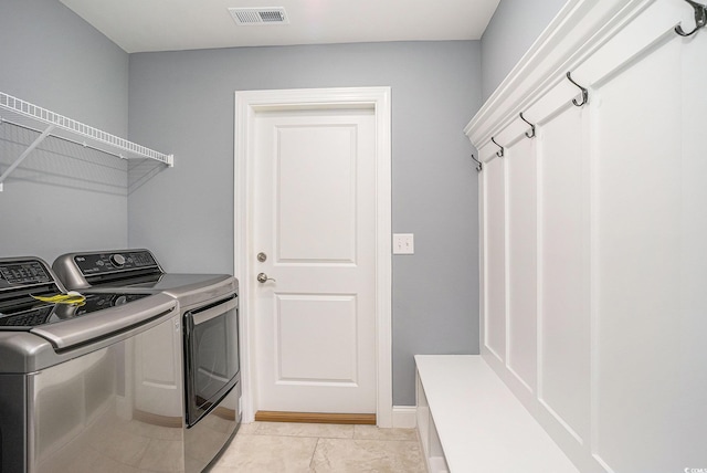 2004 Potomac Ct, Myrtle Beach, SC 29579 - washroom with washing machine and clothes dryer and light tile patterned floors