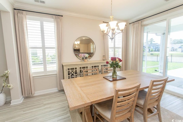 5059 Sundrop Ln, Little River, SC 29566 - dining space with crown molding, a chandelier, and light wood-style flooring