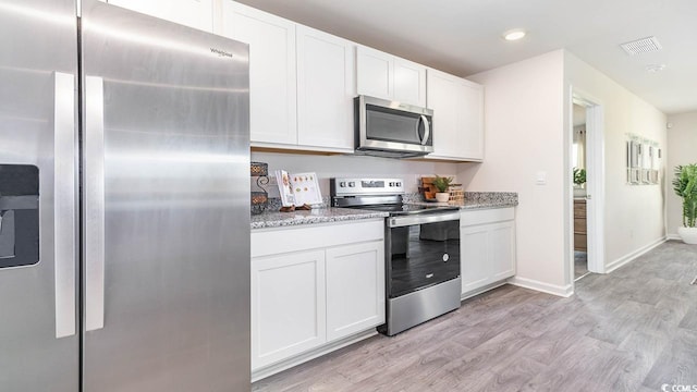 140 Dagger Ct, Myrtle Beach, SC 29588 - kitchen with appliances with stainless steel finishes, white cabinetry, light wood-style flooring, and recessed lighting