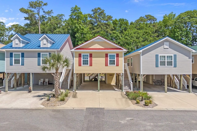 4319 Grande Harbour Blvd, Little River, SC 29566 - beach home featuring stairs, a carport, and concrete driveway