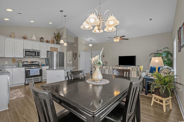 4319 Grande Harbour Blvd, Little River, SC 29566 - dining area with wood finished floors, a chandelier, a ceiling fan, lofted ceiling, and recessed lighting