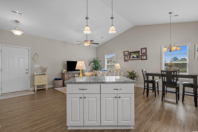 4319 Grande Harbour Blvd, Little River, SC 29566 - kitchen featuring ceiling fan, hanging light fixtures, white cabinetry, a chandelier, and high vaulted ceiling