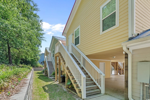 4319 Grande Harbour Blvd, Little River, SC 29566 - view of home's exterior featuring stairs and metal roof