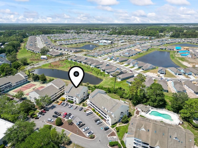1100 Possum Trot Rd Unit C-203, North Myrtle Beach, SC 29582 - aerial overview of property's location with a large body of water, a pool area, and nearby suburban area