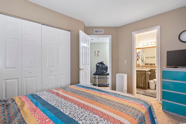 1100 Possum Trot Rd Unit C-203, North Myrtle Beach, SC 29582 - bedroom featuring a closet, carpet, and ensuite bathroom