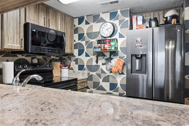 1100 Possum Trot Rd Unit C-203, North Myrtle Beach, SC 29582 - kitchen with stainless steel fridge, black range with electric cooktop, a textured ceiling, backsplash, and light stone countertops