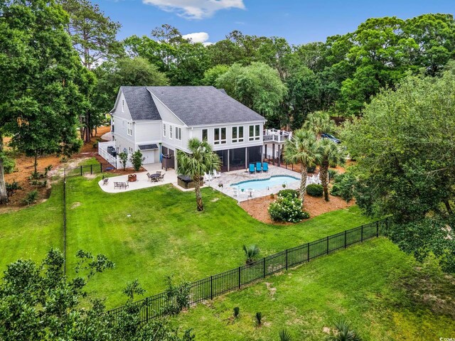 113 Trotter Trl, Georgetown, SC 29440 - back of house with a fire pit, a patio, a garage, roof with shingles, and stairs
