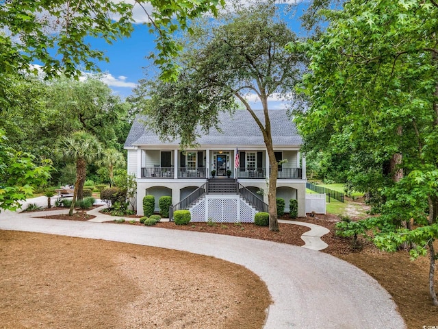 113 Trotter Trl, Georgetown, SC 29440 - beach home featuring stairway, curved driveway, covered porch, and roof with shingles