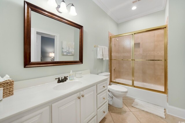 113 Trotter Trl, Georgetown, SC 29440 - bathroom featuring vanity, toilet, crown molding, combined bath / shower with glass door, and tile patterned floors