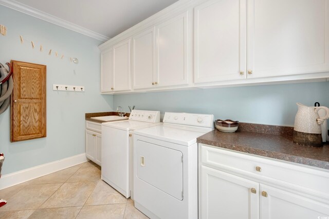 113 Trotter Trl, Georgetown, SC 29440 - washroom featuring cabinet space, washer and clothes dryer, crown molding, baseboards, and light tile patterned floors