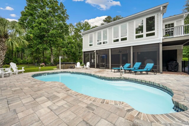 113 Trotter Trl, Georgetown, SC 29440 - outdoor pool featuring a hot tub, a sunroom, a patio, a grill, and ceiling fan