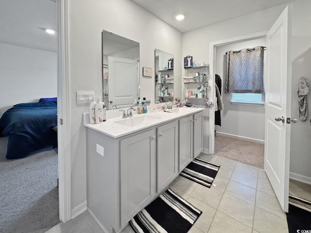 2230 Ainsley Dr, Little River, SC 29566 - bathroom with double vanity, connected bathroom, tile patterned flooring, and recessed lighting