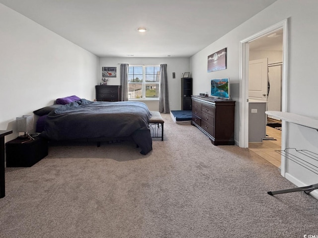 2230 Ainsley Dr, Little River, SC 29566 - bedroom featuring light carpet, ensuite bath, and light tile patterned floors