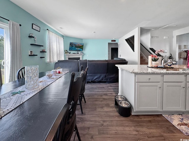 2230 Ainsley Dr, Little River, SC 29566 - dining space featuring plenty of natural light, dark wood-style floors, and stairs
