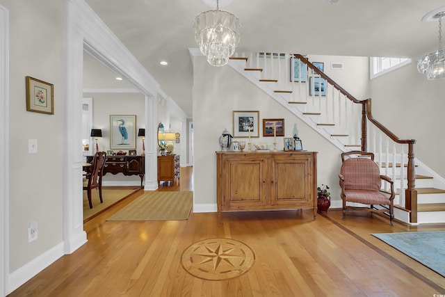92 High Hammock Way, Pawleys Island, SC 29585 - entryway with a chandelier, light wood-style flooring, stairs, baseboards, and recessed lighting