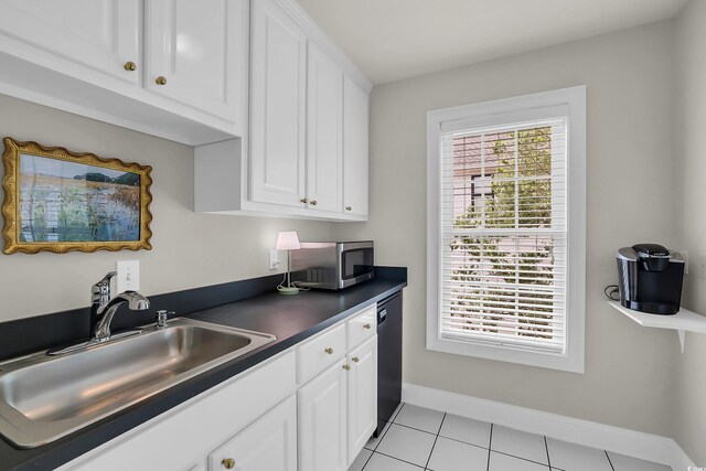 92 High Hammock Way, Pawleys Island, SC 29585 - kitchen with a sink, dark countertops, white cabinetry, baseboards, and stainless steel microwave