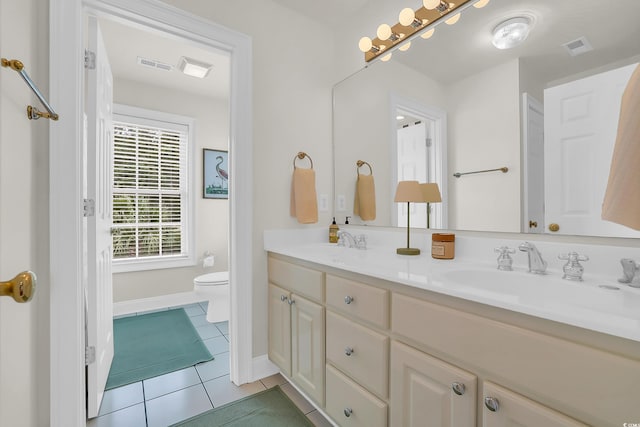 92 High Hammock Way, Pawleys Island, SC 29585 - bathroom featuring tile patterned floors, double vanity, toilet, and baseboards