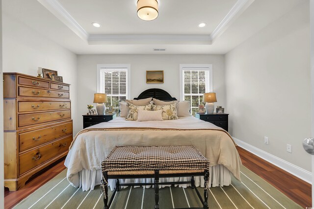 92 High Hammock Way, Pawleys Island, SC 29585 - bedroom with a tray ceiling, dark wood finished floors, crown molding, baseboards, and recessed lighting