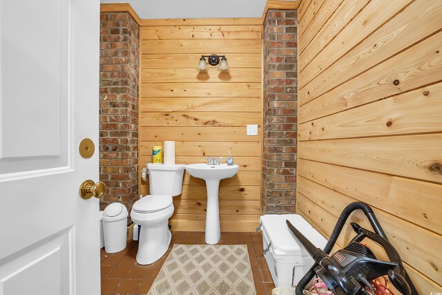 92 High Hammock Way, Pawleys Island, SC 29585 - bathroom featuring toilet, wood walls, tile patterned flooring, and a sink