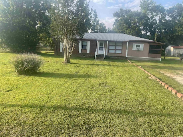 704 W Alder St, Andrews, SC 29510 - single story home featuring a front lawn and metal roof