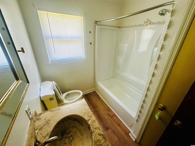 704 W Alder St, Andrews, SC 29510 - bathroom featuring wood finished floors, toilet, and  shower combination