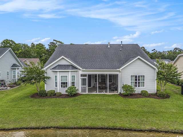 364 Palm Lakes Blvd, Little River, SC 29566 - rear view of house with a sunroom, roof with shingles, and a lawn