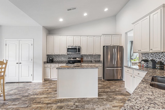 364 Palm Lakes Blvd, Little River, SC 29566 - kitchen featuring appliances with stainless steel finishes, recessed lighting, decorative backsplash, a center island, and dark wood-style floors