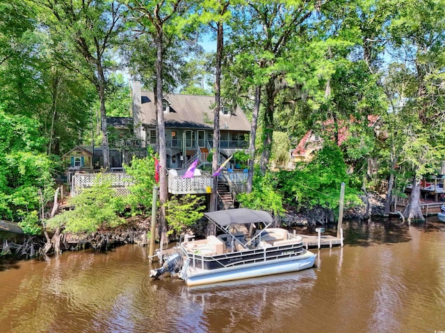 515 River Rd, Conway, SC 29526 - dock with a water view, stairs, and view of wooded area