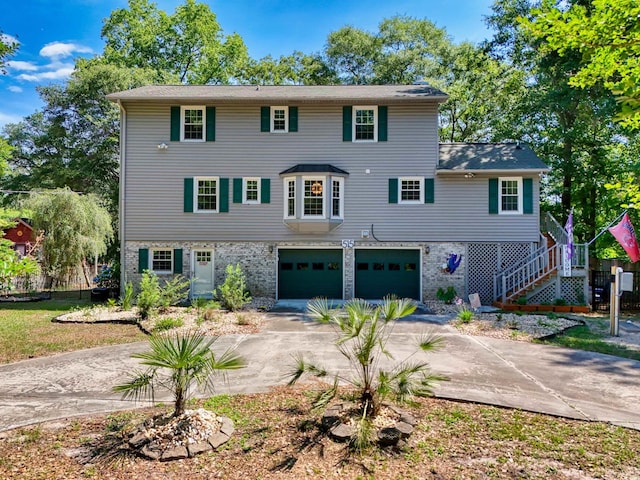 515 River Rd, Conway, SC 29526 - view of front of house featuring driveway, a garage, stairs, and brick siding