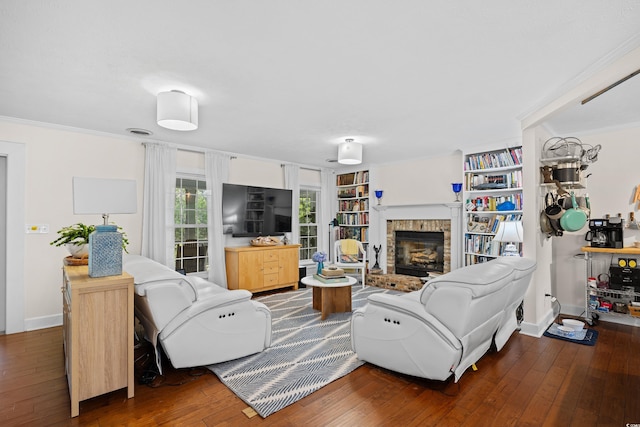 515 River Rd, Conway, SC 29526 - living room featuring wood-type flooring, ornamental molding, a fireplace, baseboards, and built in shelves