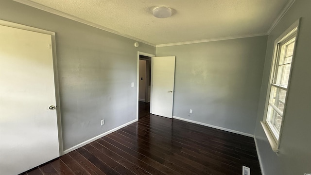 6805 Mclaurin Rd, Mullins, SC 29574 - empty room with wood finished floors, crown molding, and a textured ceiling