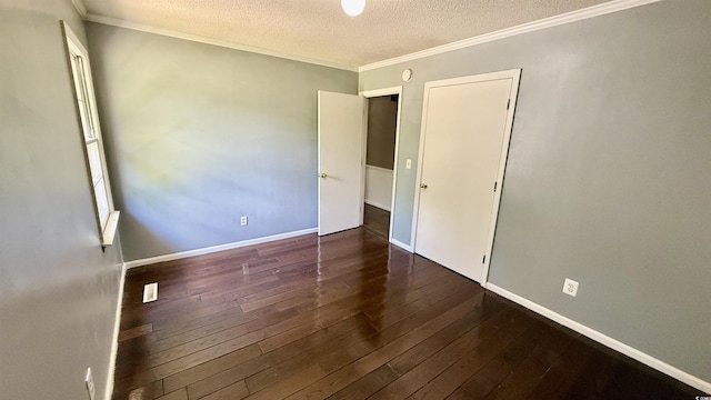 6805 Mclaurin Rd, Mullins, SC 29574 - unfurnished bedroom featuring a textured ceiling, wood-type flooring, and crown molding