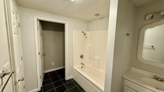6805 Mclaurin Rd, Mullins, SC 29574 - full bathroom featuring tile patterned floors, vanity, a textured ceiling, and shower / tub combination
