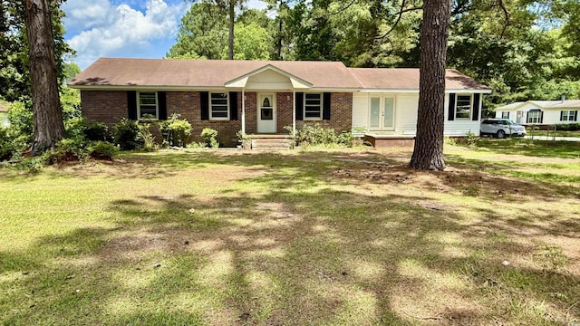 6805 Mclaurin Rd, Mullins, SC 29574 - ranch-style home featuring a front yard and brick siding