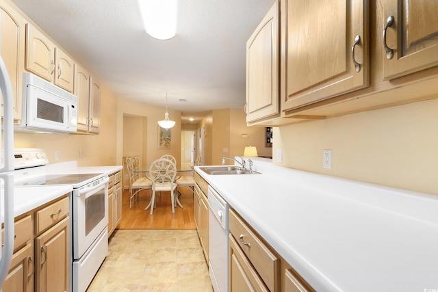 4280 Santolina Way Unit C, Murrells Inlet, SC 29576 - kitchen featuring white appliances, a sink, light countertops, light brown cabinetry, and hanging light fixtures