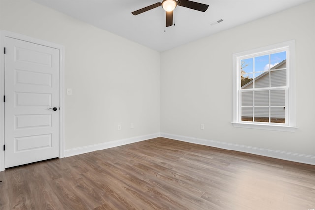 146 Temple Dr, Aynor, SC 29511 - unfurnished room with wood finished floors, ceiling fan, and baseboards