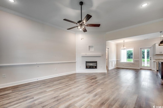 142 Temple Dr, Aynor, SC 29511 - unfurnished living room featuring ornamental molding, wood finished floors, ceiling fan, a fireplace, and recessed lighting