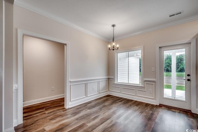 142 Temple Dr, Aynor, SC 29511 - unfurnished dining area featuring a chandelier, dark wood-style floors, crown molding, and wainscoting