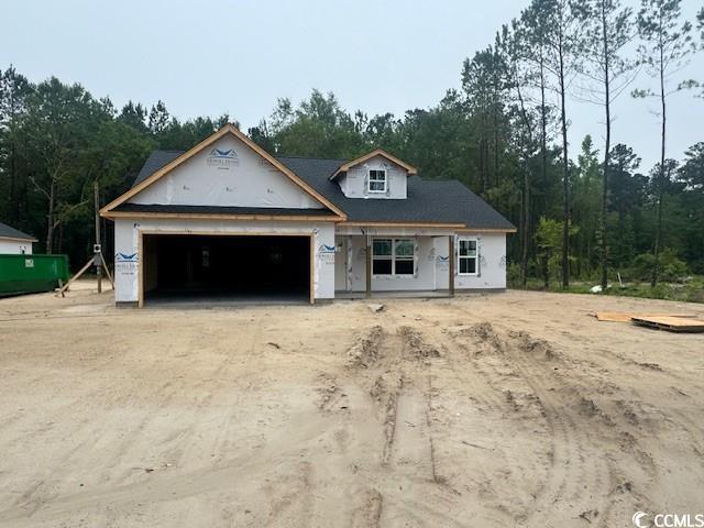142 Temple Dr, Aynor, SC 29511 - property under construction featuring an attached garage and dirt driveway