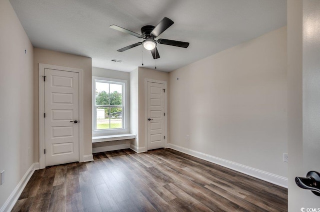 142 Temple Dr, Aynor, SC 29511 - empty room featuring dark wood-style flooring, ceiling fan, and baseboards