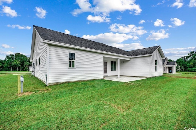 142 Temple Dr, Aynor, SC 29511 - rear view of property with a patio, a yard, and roof with shingles