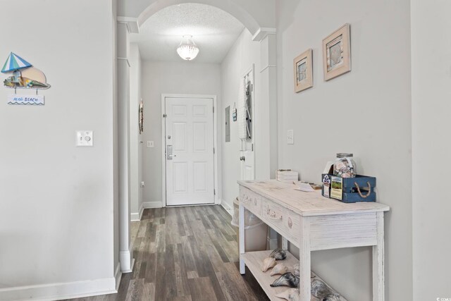 5801 Oyster Catcher Dr Unit 332, North Myrtle Beach, SC 29582 - hall featuring arched walkways, wood finished floors, and baseboards