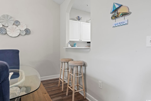 5801 Oyster Catcher Dr Unit 332, North Myrtle Beach, SC 29582 - living area featuring dark wood finished floors, baseboards, and arched walkways