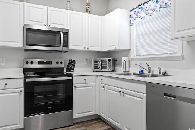 5801 Oyster Catcher Dr Unit 332, North Myrtle Beach, SC 29582 - kitchen with appliances with stainless steel finishes, a sink, light countertops, and white cabinets