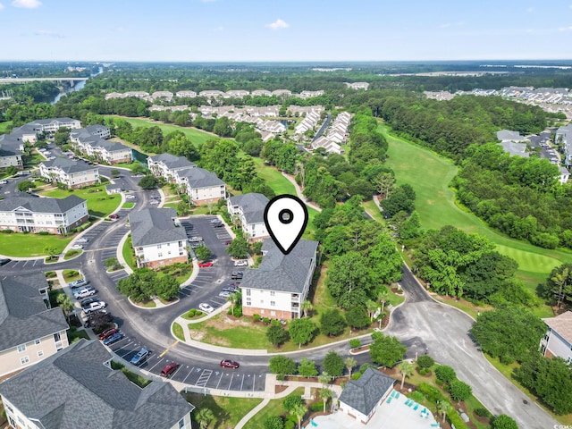 5801 Oyster Catcher Dr Unit 332, North Myrtle Beach, SC 29582 - aerial overview of property's location with a golf course and a tree filled landscape