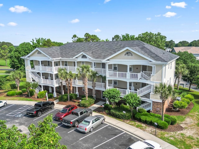 5801 Oyster Catcher Dr Unit 332, North Myrtle Beach, SC 29582 - view of building exterior with uncovered parking